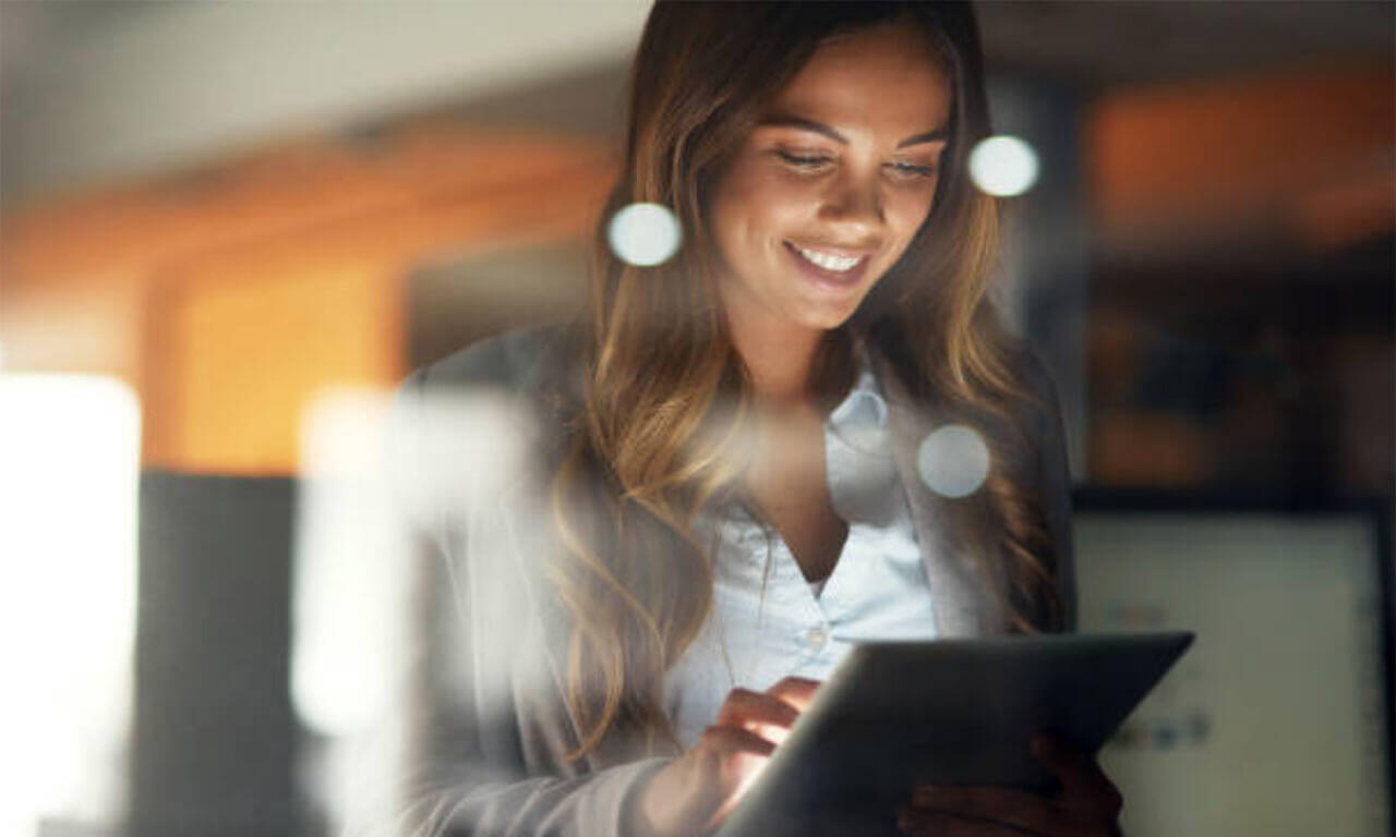 woman looking at websites on ipad
